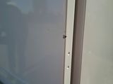 a close up of a white refrigerator with the door open