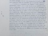 an old document with writing on it sitting on a table
