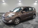 a picture of a brown car in a showroom