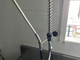 a sink with a faucet attached to it in a kitchen
