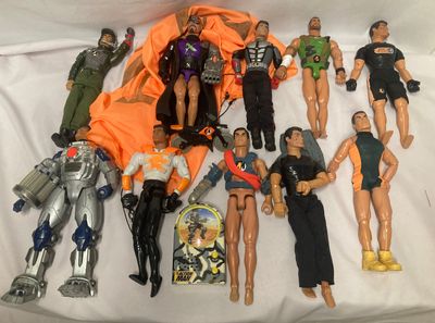 a lot of action figures that are laying on a bed