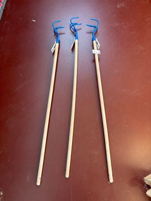 two pairs of chopsticks sitting on top of a table next to a pair of scissors