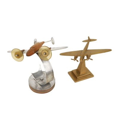 pair of metal airplanes with wooden bases on a white background