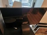 a flat screen tv sitting on top of a table