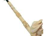 an image of a carved pipe with a man ' s head on it