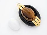 gold plated pendant with a tiger eye stone and an egg