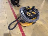 a yellow and black bag of tools on the floor