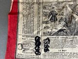 a red and black handkerchief with a picture of a man on horseback