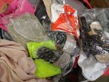 a pile of clothes and other items in a bag