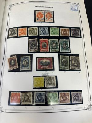 an open book with a bunch of different stamps on it