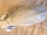 a white elephant figurine that is on a table