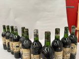 bottles of wine lined up in a row on a table
