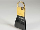 an image of a black purse with a gold padlock on it