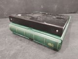 two books stacked on top of each other on a table