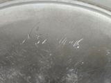 a close up of a metal pan with a handle