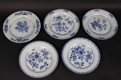 six blue and white plates with floral designs on them on a table