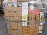 a metal cart with boxes on top of it in a warehouse