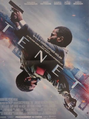 the movie poster for the film ' s release shows a man in a suit holding a gun