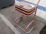 a toilet that is sitting on a cart in a room