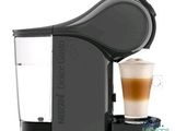 a close up of a coffee machine with a cup of coffee