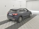 the mercedes gle is parked in a garage with a checkered floor