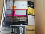a cardboard box filled with electronic devices and other items