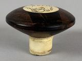 a mushroom shaped object with a black and white design on it