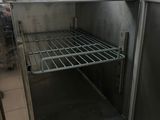 an open refrigerator in a kitchen with no doors
