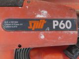 a close up of a red machine with a black label on it