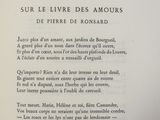 a book with a poem written in french on it