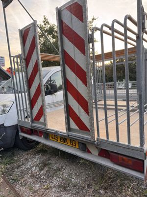 a truck that has a gate on the back of it