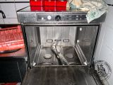 a silver oven with a lot of food inside of it