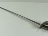 a sword that is sitting on a white table