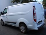a white van that is parked in a parking lot