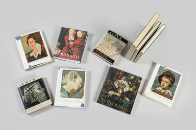 a lot of books that are sitting on a table