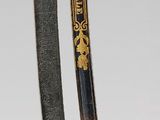 pair of two swords with gold and black handles on a white background