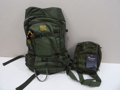 a green backpack and a cell phone on a white table