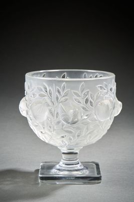 crystal bowl with floral decoration on base on grey surface
