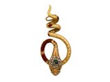 une image représentant un serpent en or tenant une pierre verte dans la bouche
