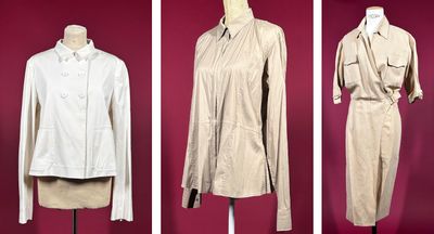 four mannequins of women ' s clothing on display in a museum