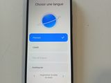 someone is checking the language of their phone on the table
