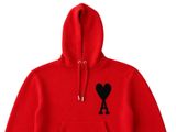 a red hoodie with a black heart on it