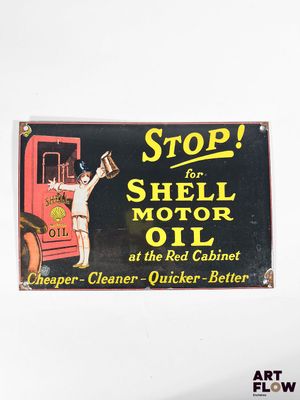a sign that says stop for shell oil at the red cabinet