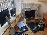 a lot of electronics on the floor in this room
