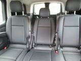 two seats in the back of a van with no one in it