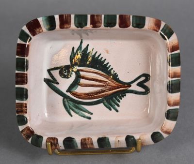 a small plate with a fish design on it