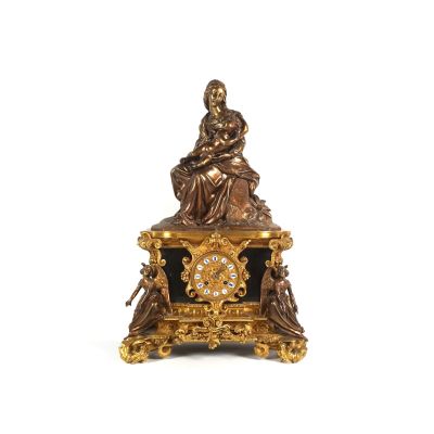 a statue of a woman sitting on top of a clock