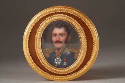 portrait of a man in a military uniform in a gold frame