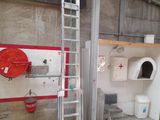 a picture of a bathroom with a toilet and a ladder