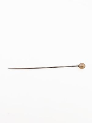 a close up of a needle with a needle tip on a white background